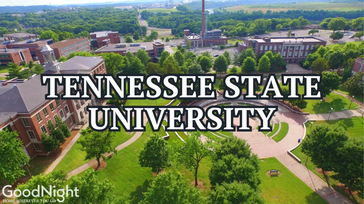 This image presents an inviting view of university buildings surrounded by a central green space with pathways and mature trees. The setting suggests an active campus environment, with ample space for outdoor studying, socializing, and attending events—perfect for business and academic travelers seeking proximity to important institutions.